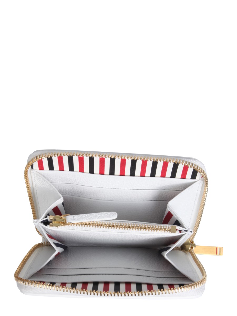THOM BROWNE      PORTAFOGLIO IN PELLE CON ZIP E DETTAGLI BROGUING 